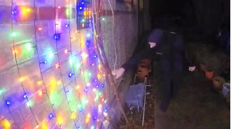Police are searching for suspects who damaged holiday decorations by cutting down lights and attacking an inflatable Santa.