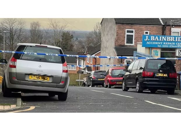 A primary school is on lockdown as a man in his 40s was stabbed and the attacker is still at large.