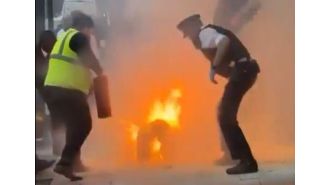 In a dispute with his partner, a man lit himself on fire in front of law enforcement.
