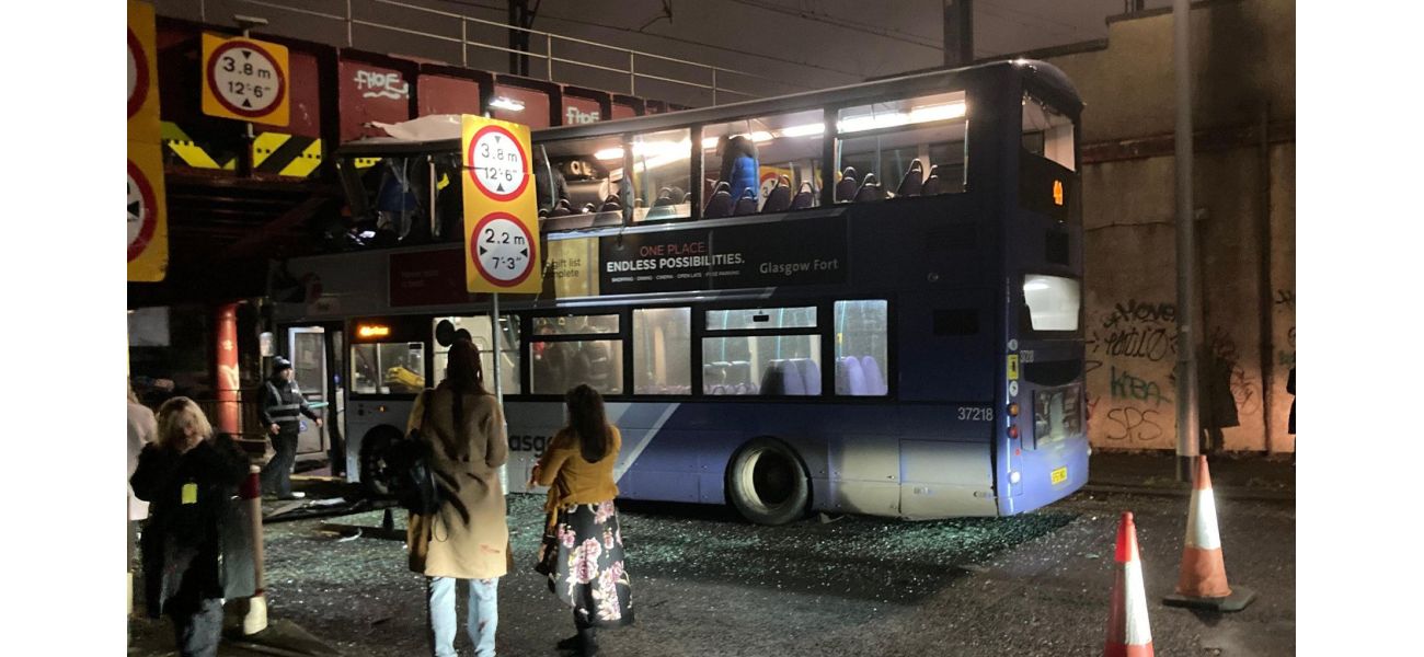 A bus passenger is critically injured after a double-decker bus crashes into a bridge.
