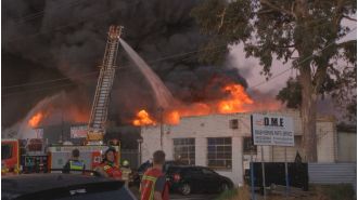 A man is in hospital after a serious fire at a mechanic shop in Melbourne.
