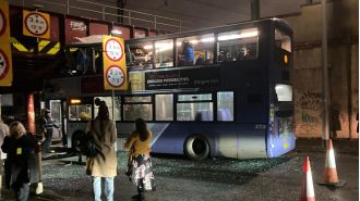 A bus passenger is critically injured after a double-decker bus crashes into a bridge.