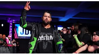 Wrestler gets physical with fan in unscripted incident at live event.