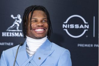 Travis Hunter dominates 2024 Heisman Trophy voting, winning by a significant margin.