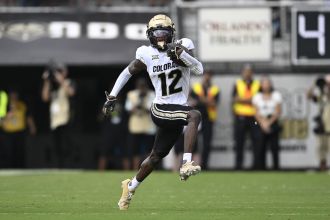 Travis Hunter's standout season for CU Buffs, with impressive stats leading to Heisman Trophy consideration.