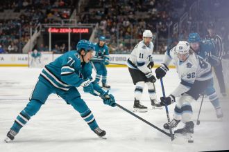 San Jose Sharks suffer defeat to Utah after a late goal in a heated game.