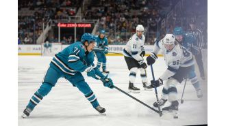 San Jose Sharks suffer defeat to Utah after a late goal in a heated game.