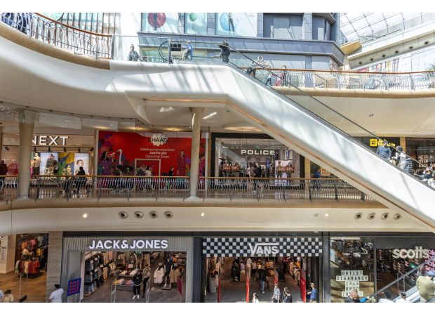 A man has passed away following a fall from the top floor of a shopping center.