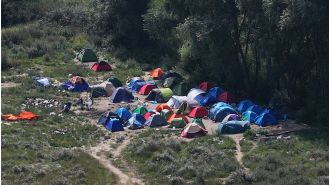 A gunman killed five people in a migrant camp in Dunkirk in a shooting spree.