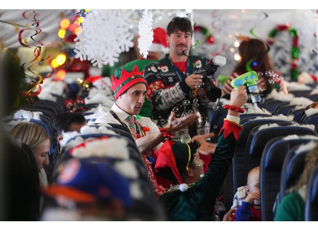 Children are flown to a North Pole experience at a renovated hangar in Denver airport to meet Santa.
