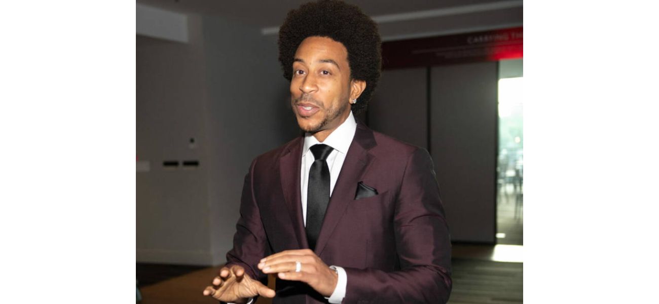 Ludacris hosts 'Ludacrismas' event, giving presents to 10 families in College Park.