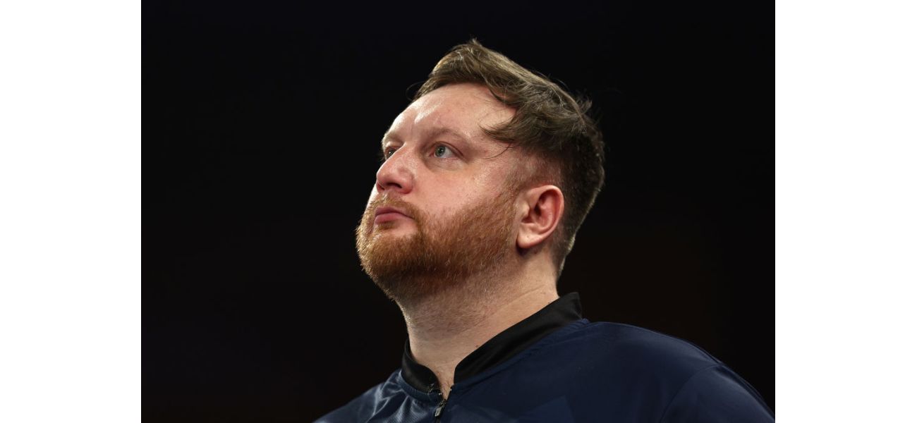 Darts player Cameron Menzies emotional after unexpected loss at World Championship.