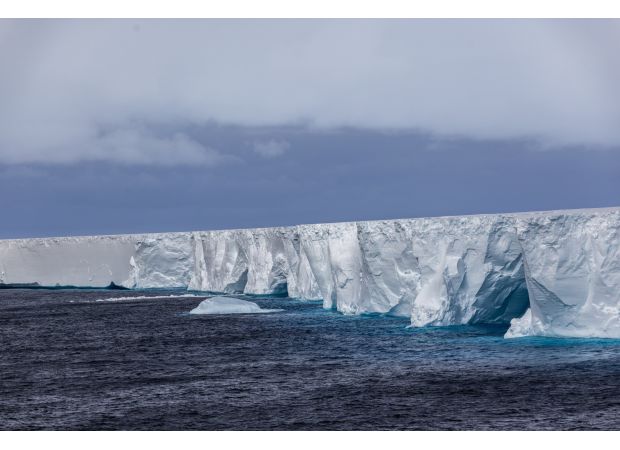 A colossal trillion-ton iceberg adrift in the ocean after breaking off.