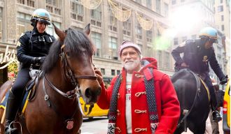 77-year-old Arnold Schwarzenegger looks just like Santa with a big, full beard.