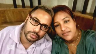 A man was imprisoned for violently killing his wife with an axe in front of their teenage children.