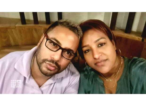 A man was imprisoned for violently killing his wife with an axe in front of their teenage children.