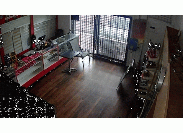 15-year-old driver crashes into Brisbane vape shop, captured on video.