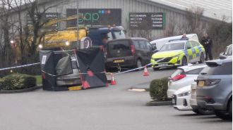 Elderly woman arrested for killing man found in car.