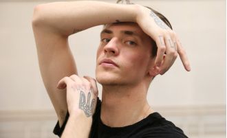 Russian ballet dancer with tattoos of Putin announces plans to leave country for personal reasons.