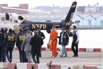 Luigi Mangione, with restraints, was taken off a helicopter in New York to attend a court hearing.