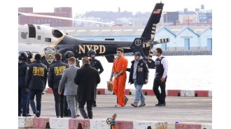 Luigi Mangione, with restraints, was taken off a helicopter in New York to attend a court hearing.