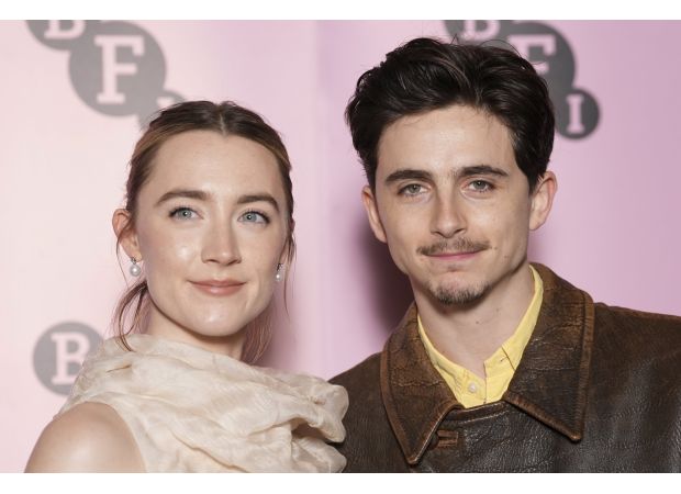 Timothee Chalamet shares his experience of being sworn at by Saoirse Ronan while filming.