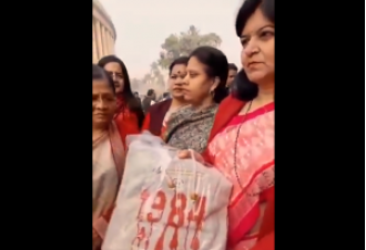 BJP lawmaker Aparajita Sarangi gives Priyanka Gandhi a '1984' bag as a gift.