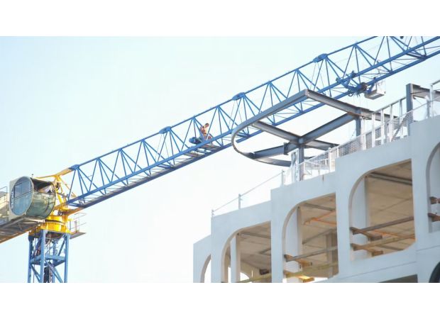 Police apprehended a shirtless man who caused a standoff on a crane.