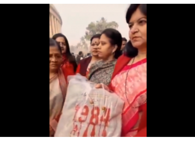 BJP lawmaker Aparajita Sarangi gives Priyanka Gandhi a '1984' bag as a gift.