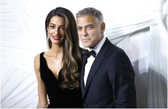 George Clooney is making an effort to make his 7-year-old twins less British.