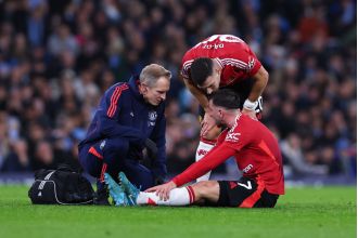 Reece James consoles Mason Mount of Manchester United after he suffers a heartbreaking injury.