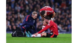Reece James consoles Mason Mount of Manchester United after he suffers a heartbreaking injury.