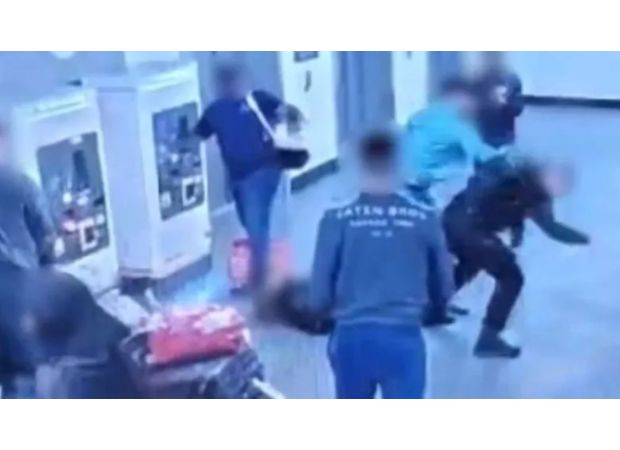 Two individuals accused of attacking officers at Manchester Airport.