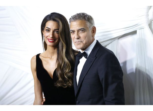 George Clooney is making an effort to make his 7-year-old twins less British.