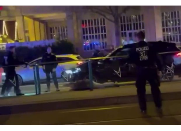 Suspect apprehended after car drives into crowded holiday market.