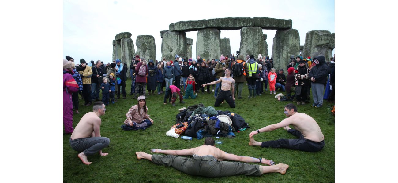 Crowds flock to Stonehenge for ancient ritual with a long history.