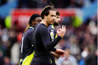 Grealish responds to taunting Villa fans with gesture during Man City loss.