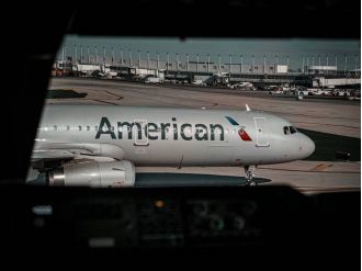 American Airlines has resolved a lawsuit alleging racial discrimination brought by three African American men.