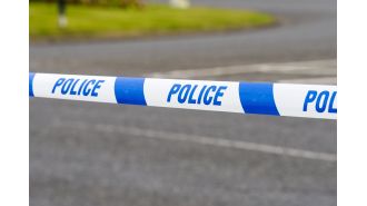 An infant died in a caravan, where a man was arrested for neglect.