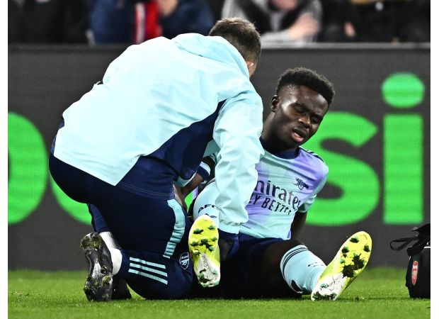 Arsenal's Bukayo Saka injured during match against Crystal Palace.
