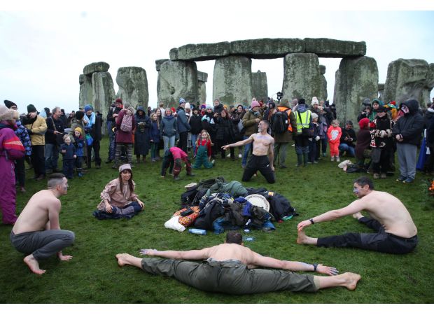 Crowds flock to Stonehenge for ancient ritual with a long history.
