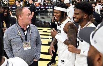 CU Buffs football team and Travis Hunter were honored and recognized at a basketball game.