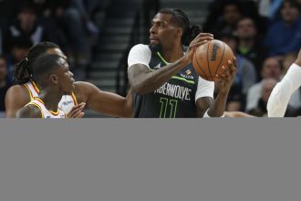 Warriors, led by Curry, defeat Timberwolves on the road with strong defense.