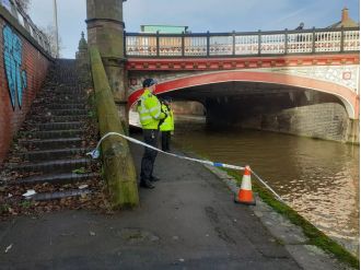 Law enforcement looking into suspicious death following discovery of body in waterway.