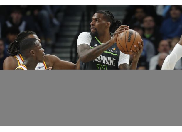 Warriors, led by Curry, defeat Timberwolves on the road with strong defense.