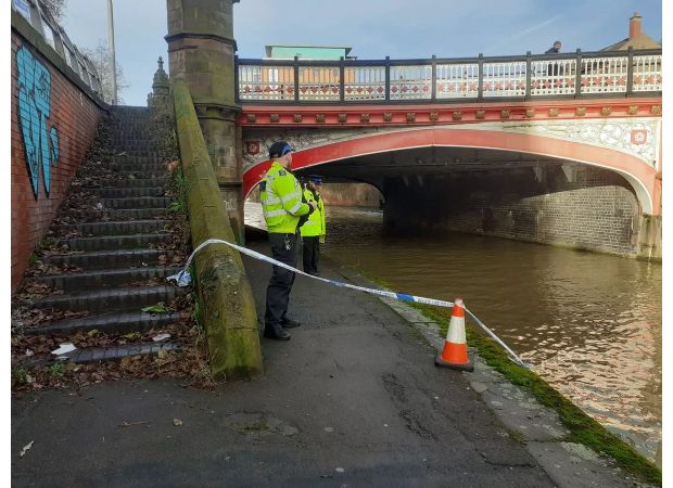 Law enforcement looking into suspicious death following discovery of body in waterway.