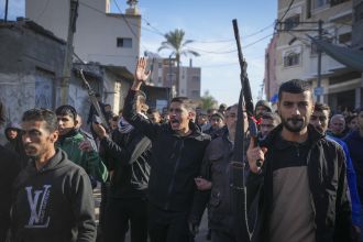 Israeli attacks in Gaza result in 22 deaths while Vatican representative attends pre-Christmas Mass with local Christians.
