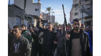 Israeli attacks in Gaza result in 22 deaths while Vatican representative attends pre-Christmas Mass with local Christians.