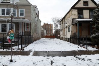 A man has been arrested for killing a woman who was living in an abandoned house with her son in Englewood.