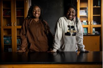 A middle school student from North Lawndale assists in the discovery of a molecule in goose droppings that can fight cancer.